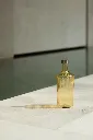 Premium_ribbed_glass_bottles_in_the_color_Cable_by_Paveau_bring_sophistication_warmth_and_refined_Belgian_design_to_every_dining_and_hospitality_set.webp