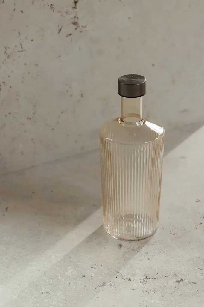 The_Ribbed_bottle_in_Bells_by_Paveau_is_designed_for_stylish_living_combining_contemporary_glassware_aesthetics_with_refined_functionality_and_timel.webp